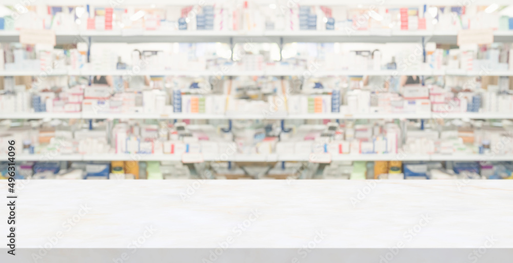 Empty white marble counter top with blur pharmacy drugstore shelves background