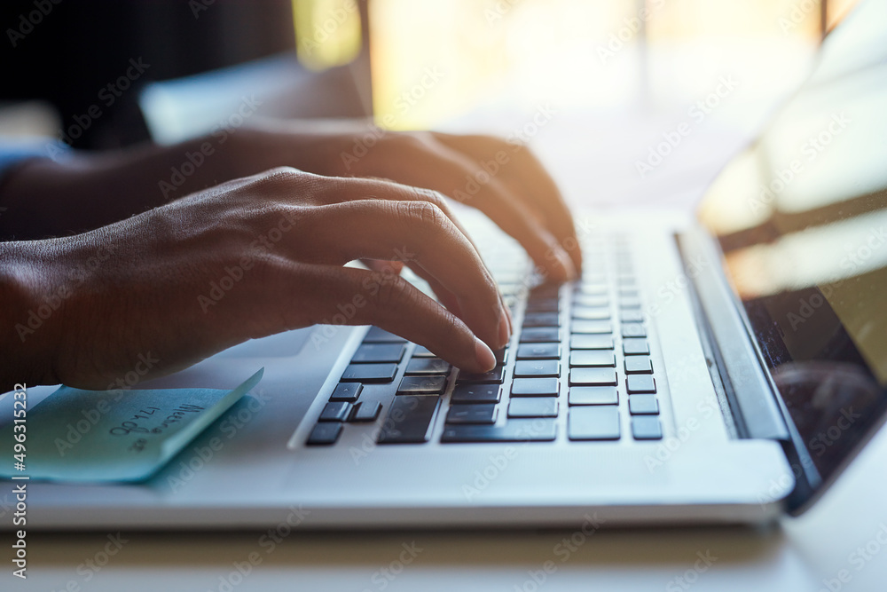 Its a different form of hands-on design. Cropped shot of an unrecognizable male designer working on a laptop in his office. Its a different form of hands-on design. Cropped shot of an unrecognizable male designer working on a laptop in his office.
