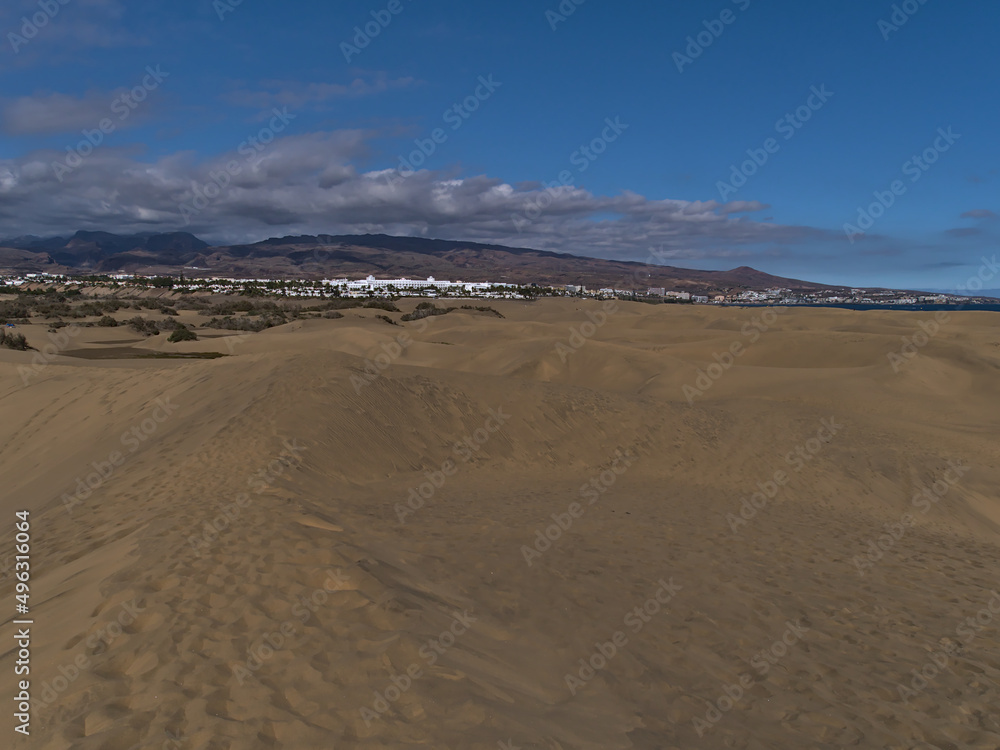 View of popular natural reserve Dunas de Maspalomas in the south of island Gran Canaria, Canary Islands, Spain on the Atlantic coast with sand dunes.