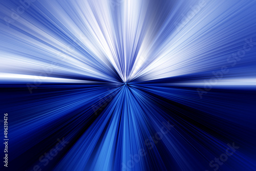 Abstract radial zoom blur surface in dark blues and light blues tones. Bright blue background with radial, radiating, converging lines. The background is divided into two parts.