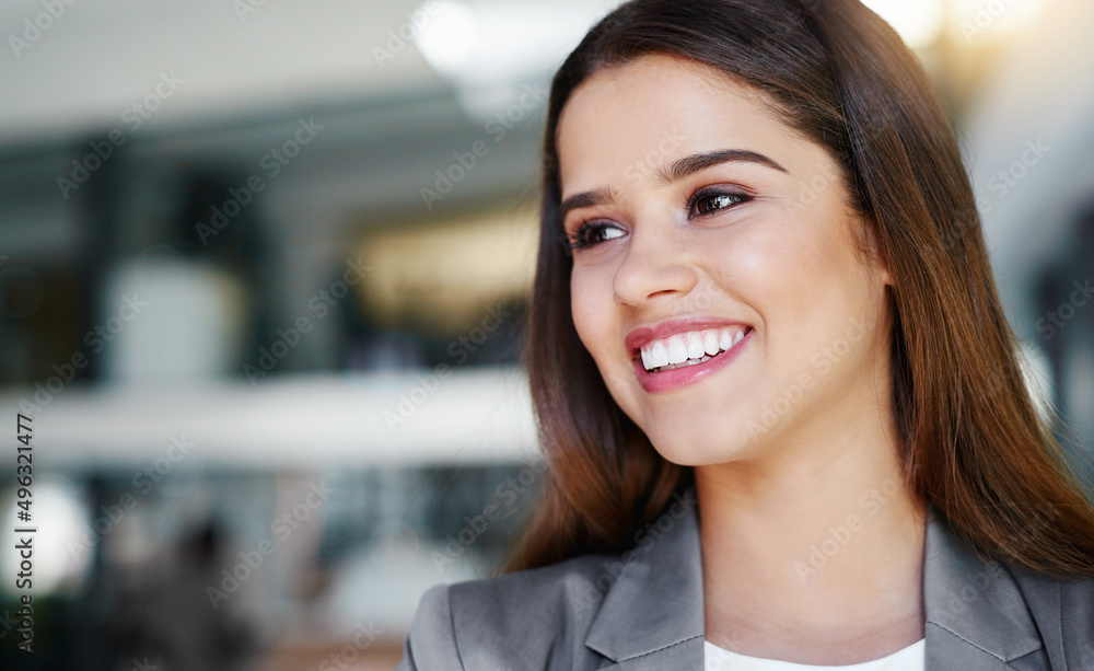 Young and inspired. Cropped shot of an attractive young businesswoman in the office. Young and inspired. Cropped shot of an attractive young businesswoman in the office.