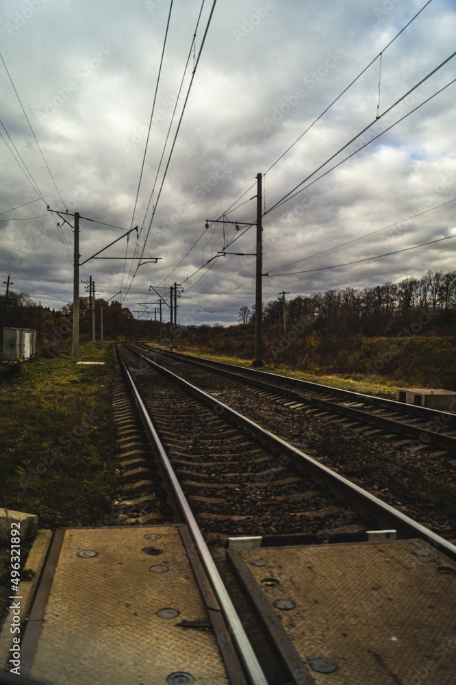 Railway tracks. Railway tracks and electronic wires. The railway near the forest Railway tracks. Railway tracks and electronic wires. The railway near the forest