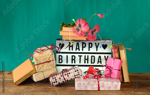 Canvas Print gift-wrapped books as birthday present, sign with lettering happy birthday and decoration