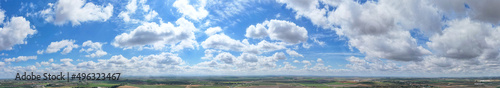 Impressive panoramic shot of the horizon with a great blue sky with clouds