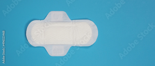 Fotografie Woman sanitary napkins on blue background