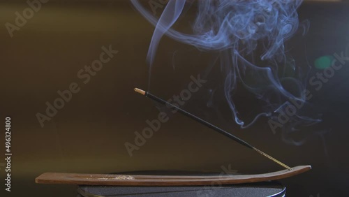 Incense, incense sticks smoldering with puffs of smoke. 4k.