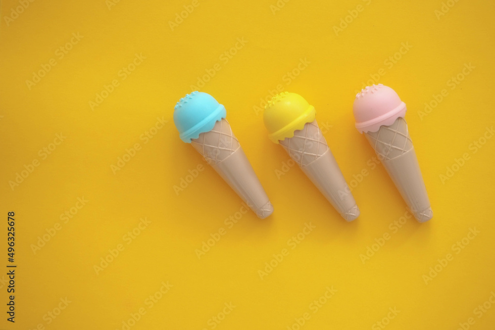 toy ice cream of different colors on a colored background toy ice cream of different colors on a colored background