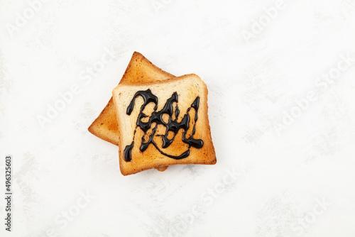 Breakfast toast with spread or pasta, top view. Toasted slices of wheat bread photo