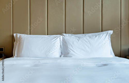 White pillows and duvet on a bed © xy