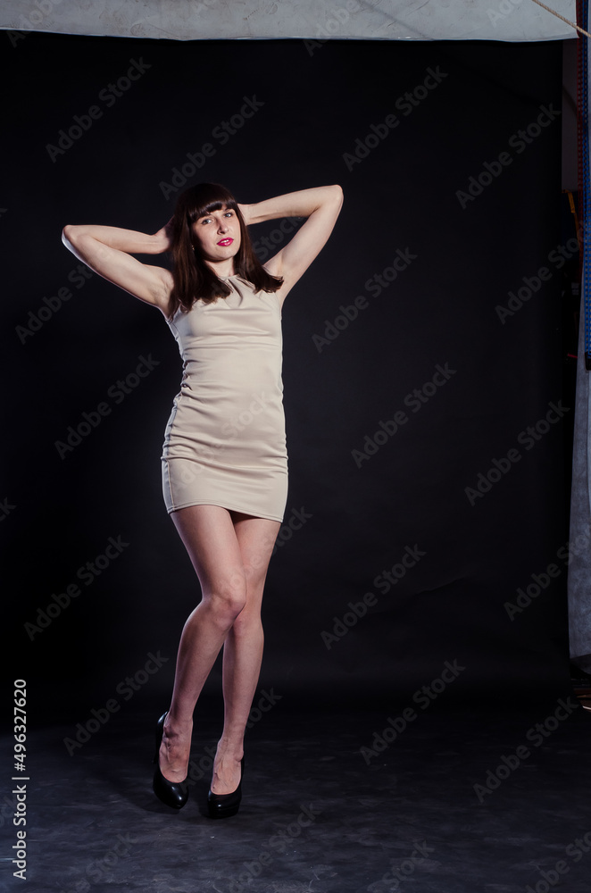 beautiful brunette girl in short blue dress