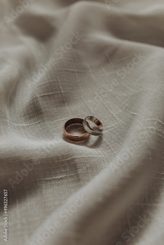 couple of ring on the white fabric. selective focus