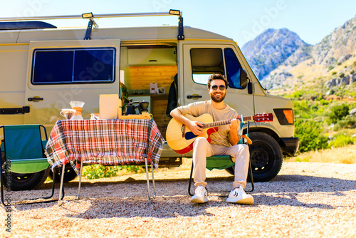 young indian man vacation travel RV, holiday trip in motorhome in mountain