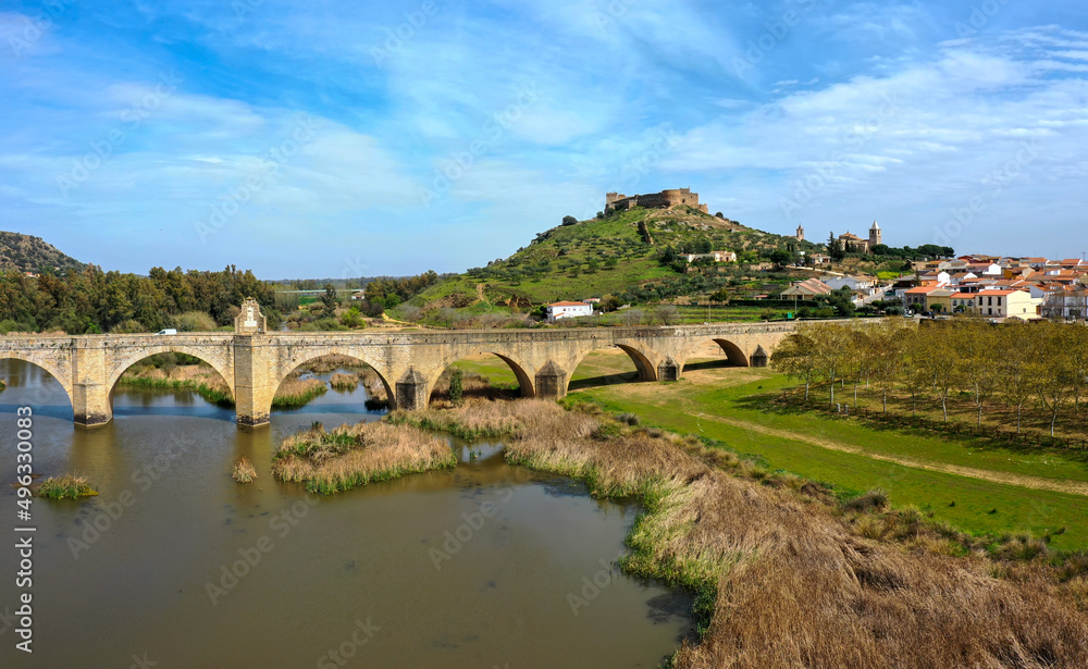 aerial view of the Guadiana River and the town of Medellin with old bridge and castle aerial view of the Guadiana River and the town of Medellin with old bridge and castle