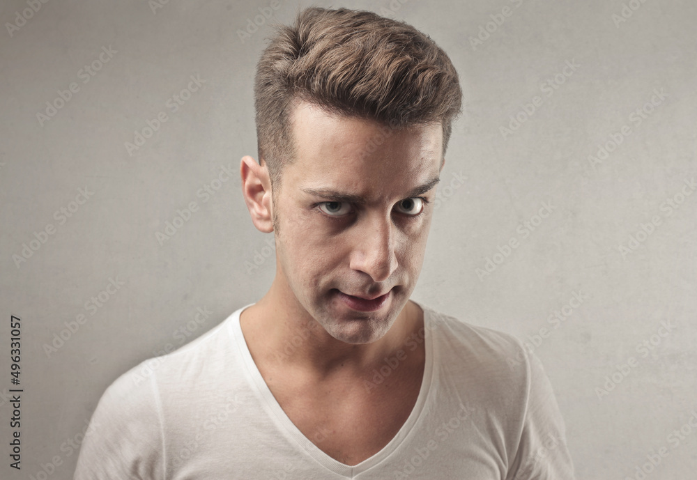 young man with angry expression young man with angry expression
