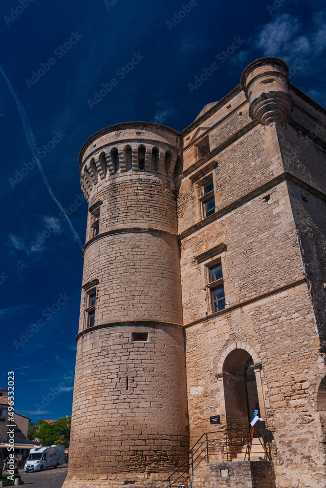 A historical castle Château de Gordes built in 16 century under a cloudy sky in a sunny day in Gordes, Avignon, Provence,  France