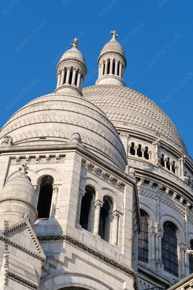 View of the beautiful and famous white church Sacred Heart at Montmartre Paris on a beautiful day