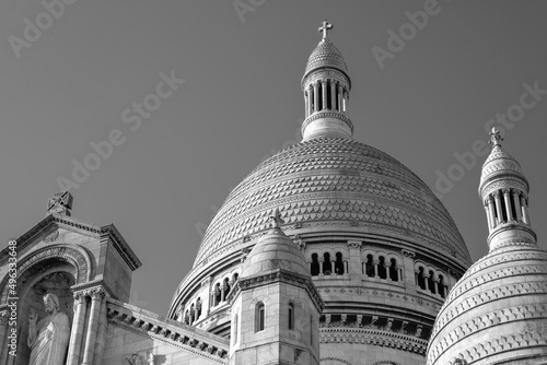 View of the beautiful and famous white church Sacred Heart at Montmartre Paris on a beautiful day in black and white