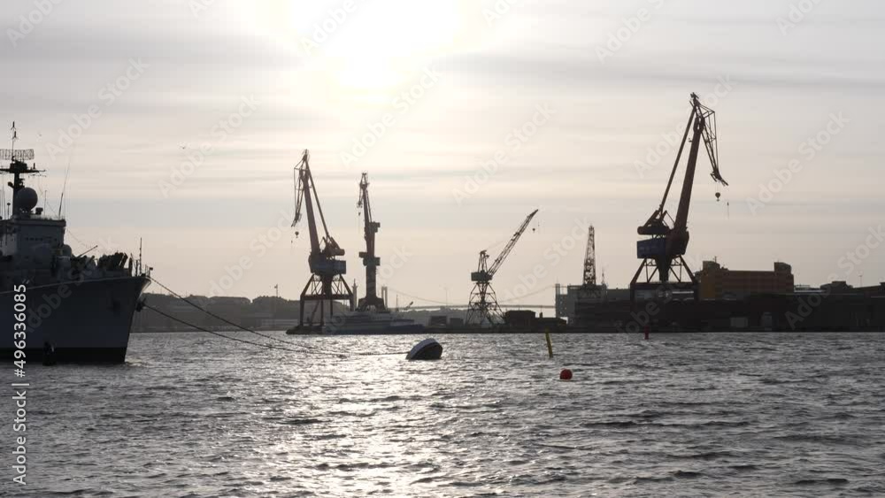 A Ship and Industrial Cranes in Gothenburg, Sweden, Silhouette Sunset Shot A Ship and Industrial Cranes in Gothenburg, Sweden, Silhouette Sunset Shot