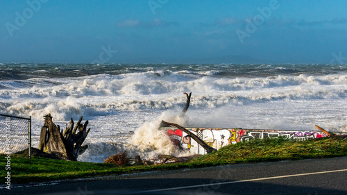 Waves Crash Over Graffiti Wall on Whidbey Island photo