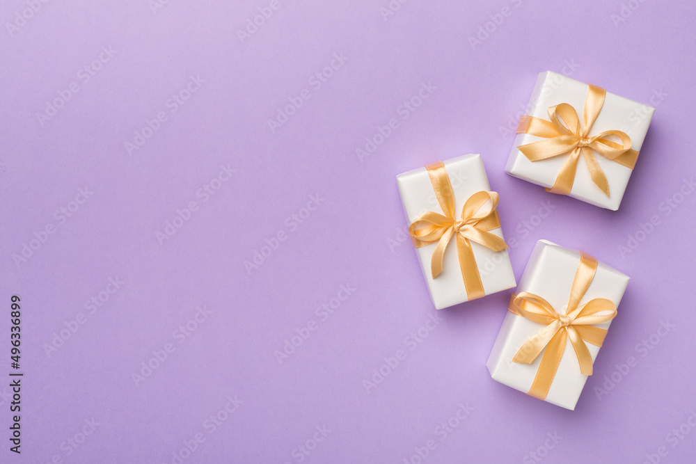 White gift boxes on color background, top view White gift boxes on color background, top view