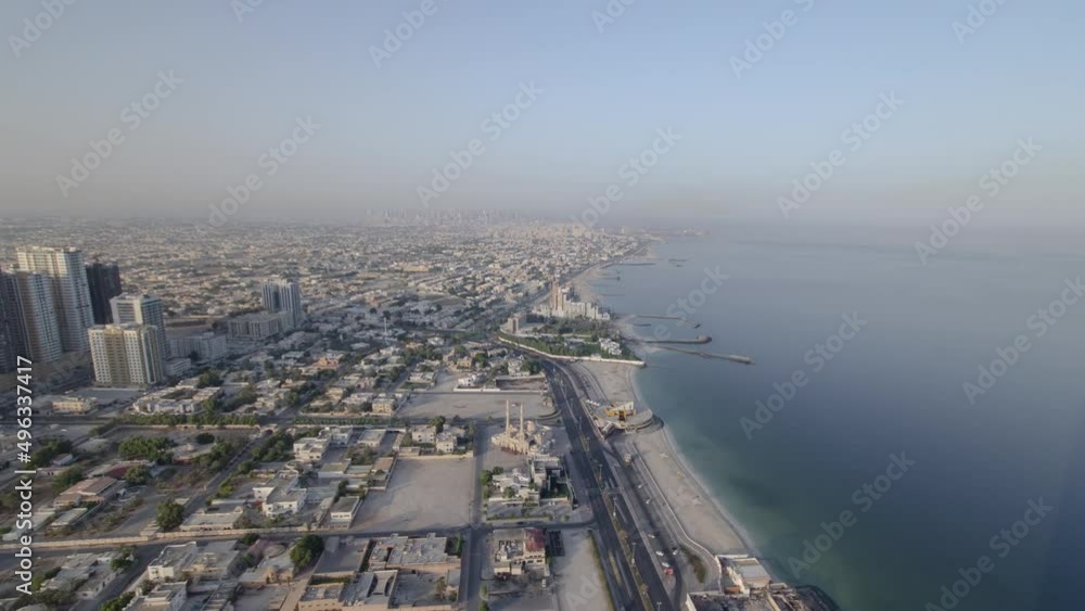 Cityscape of Ajman from rooftop during the morning after sunrise timelapse.