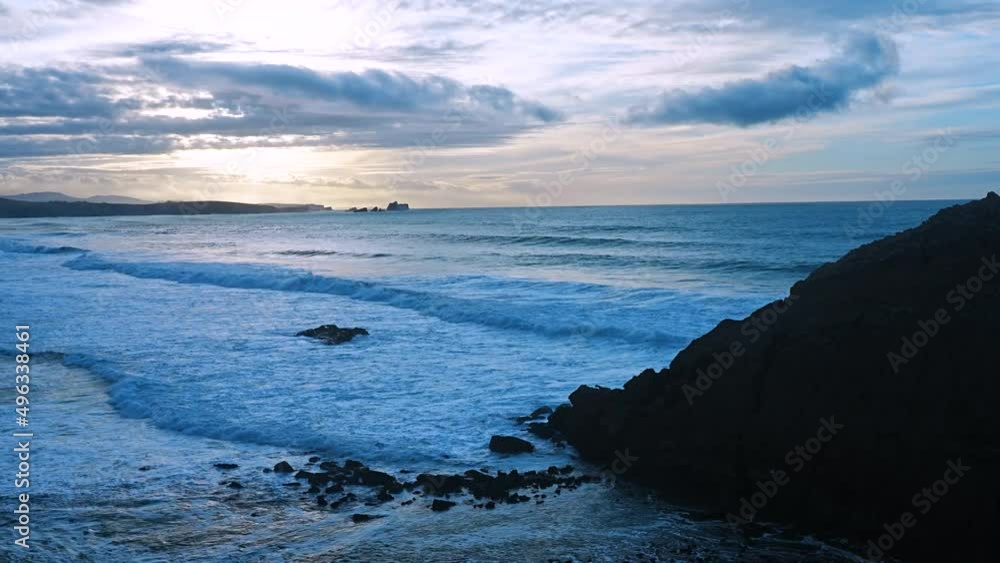 Sunset at El Madero Beach. Natural Park of the Dunes of Liencres, Liencres, Piélagos Municipality, Cantabrian Sea, Cantabria, Spain, Europe. Sunset at El Madero Beach. Natural Park of the Dunes of Liencres, Liencres, Piélagos Municipality, Cantabrian Sea, Cantabria, Spain, Europe.