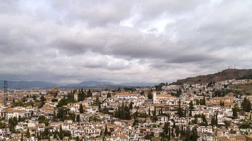 Timelapse slowly panning across Granada, Spain with fast moving clouds Timelapse slowly panning across Granada, Spain with fast moving clouds