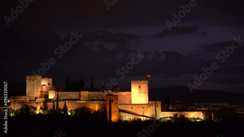 Beautiful and stunning Alhambra Palace lit up at night after blue hour