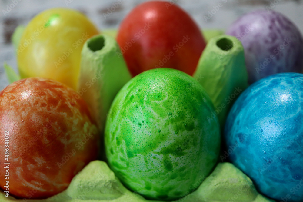 colorful easter eggs in a egg carton box close up colorful easter eggs in a egg carton box close up