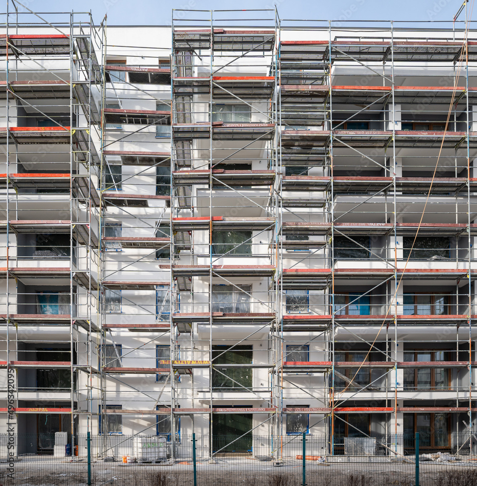scaffolding on the construction site of a block of flats scaffolding on the construction site of a block of flats