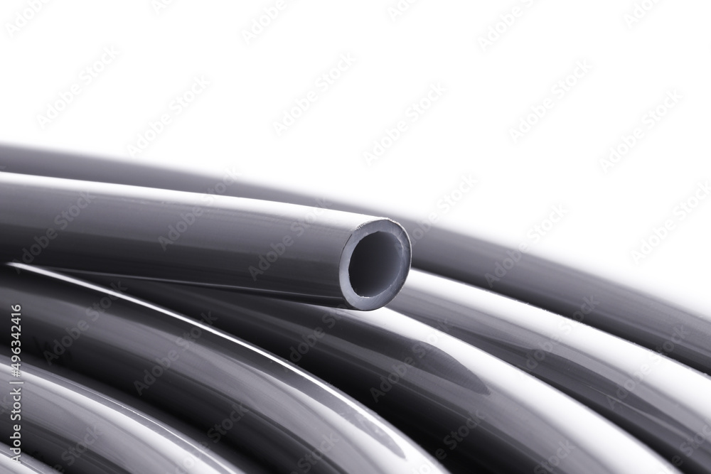 Flexible pipe on underfloor heating made of cross-linked polyethylene with an oxygen barrier. Materials for home insulation. Innovative technology. Installation for comfort and coziness.

