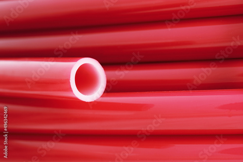Flexible pipe on underfloor heating made of cross-linked polyethylene with an oxygen barrier. Materials for home insulation. Innovative technology. Installation for comfort and coziness.

