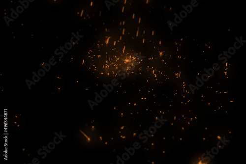 Spark Overlays. Burning red hot sparks fly from large fire in night sky. Burning embers glowing flying away particles over black background. Beautiful abstract background on the theme of fire, light.
