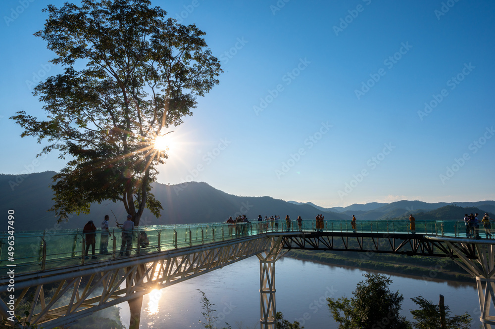 Chiang Khan, Loei, Thailand - 25 November 2021 : View of beautiful glass sky walk is landmark viewpoint bettween Thai - Laos border at Chiang Khan, Loei, Thailand