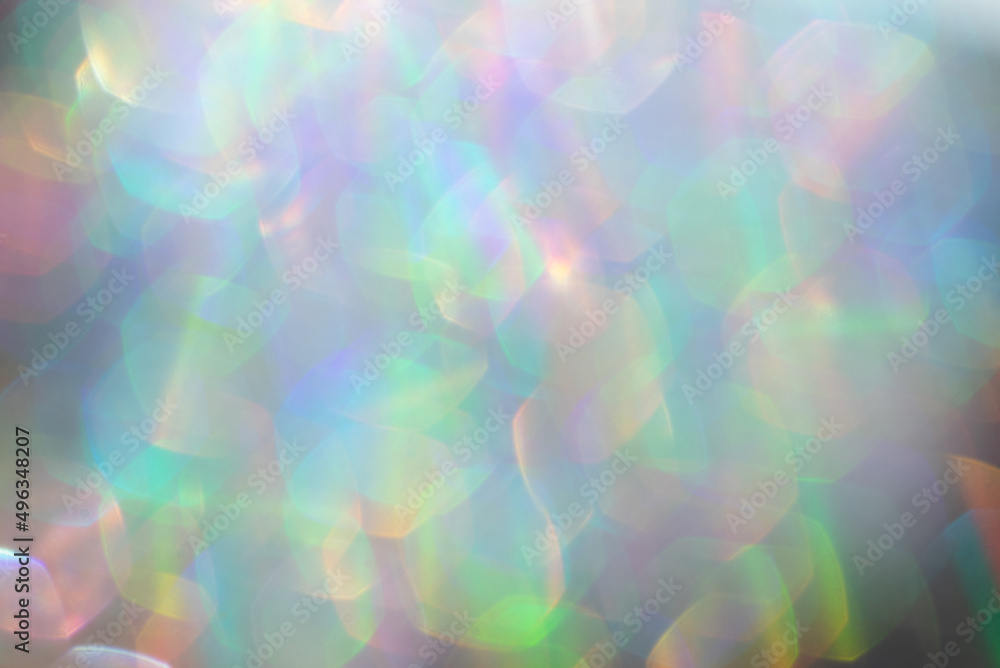 Abstract defocused holographic background with shining glitter.Good as overlay layer.
