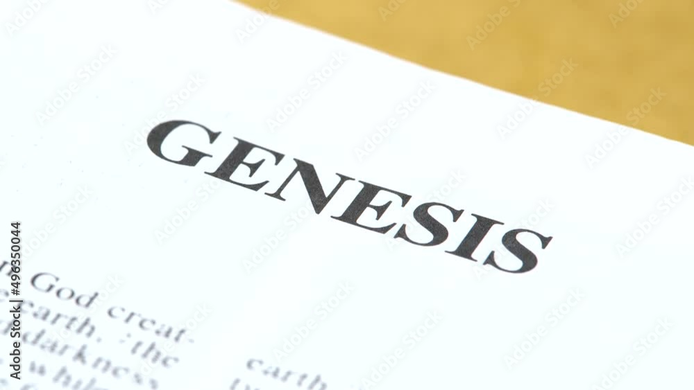 Genesis, the first book of the Old Testament, Holy Bible beginning, world universe origin story, creationism concept, single text line, word line closeup macro, detail, nobody. Book pages turning Genesis, the first book of the Old Testament, Holy Bible beginning, world universe origin story, creationism concept, single text line, word line closeup macro, detail, nobody. Book pages turning