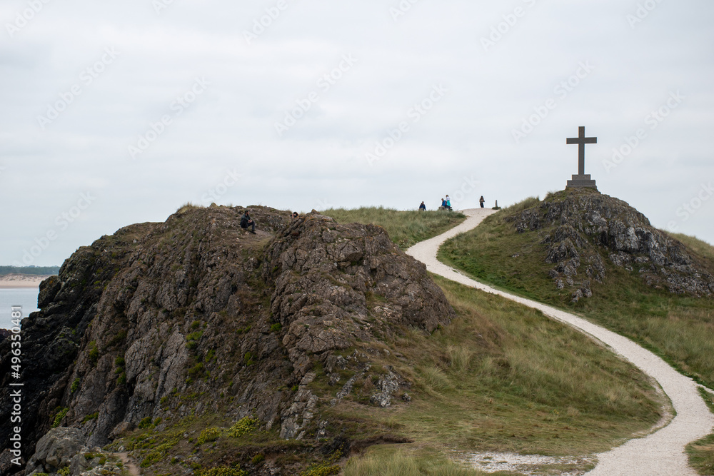 Holy Cross on the coastal island Ynys Llanddwyn. A popular tourist spot on Anglesey Island in Wales Holy Cross on the coastal island Ynys Llanddwyn. A popular tourist spot on Anglesey Island in Wales