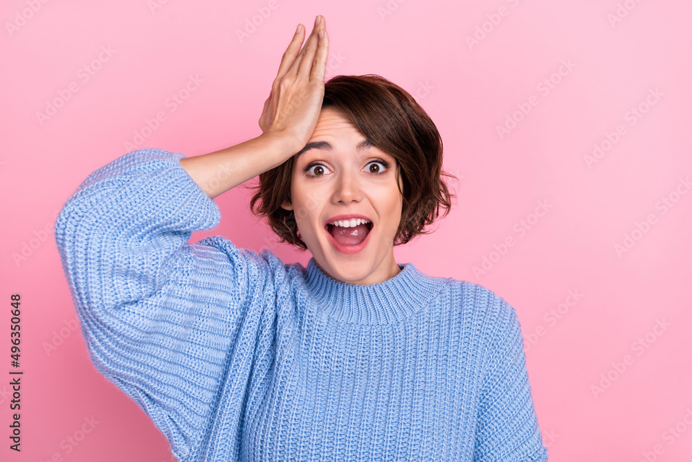 Close-up image of surprised scream girl see big bargain advertisement touch forehead isolated on pink color background Close-up image of surprised scream girl see big bargain advertisement touch forehead isolated on pink color background