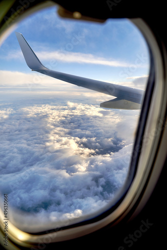 Obraz na płótnie Clouds and sky as seen through window of an airplane during flight w salonie