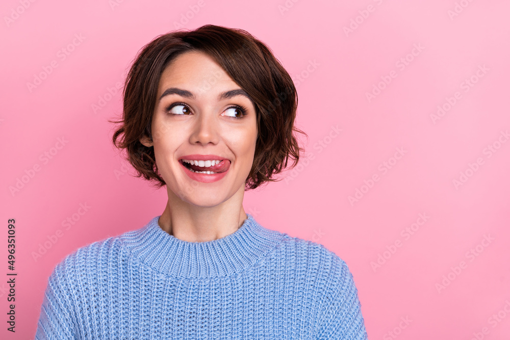 Close-up image of beautiful lady looking empty space licking lips see cool advertisement isolated on pink color background Close-up image of beautiful lady looking empty space licking lips see cool advertisement isolated on pink color background