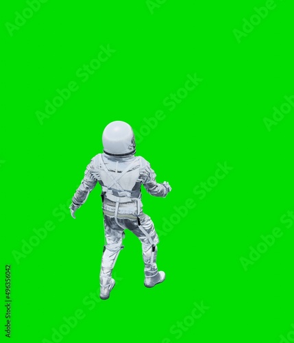 Astronaut isolated on green background
