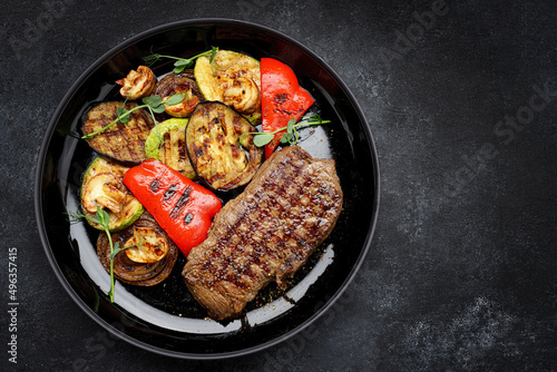Juicy steak and grilled vegetables, with spices