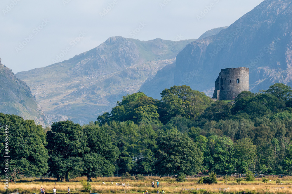 View of Dolbadarn Castle from across the water at Llyn Padarn. Below Snowdon in Snowdonia National Park, north Wales