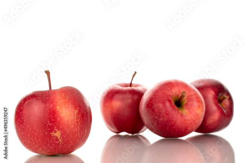 Several ripe red apples, macro, isolated on a white background.