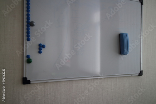 magnetic whiteboard on white office wall