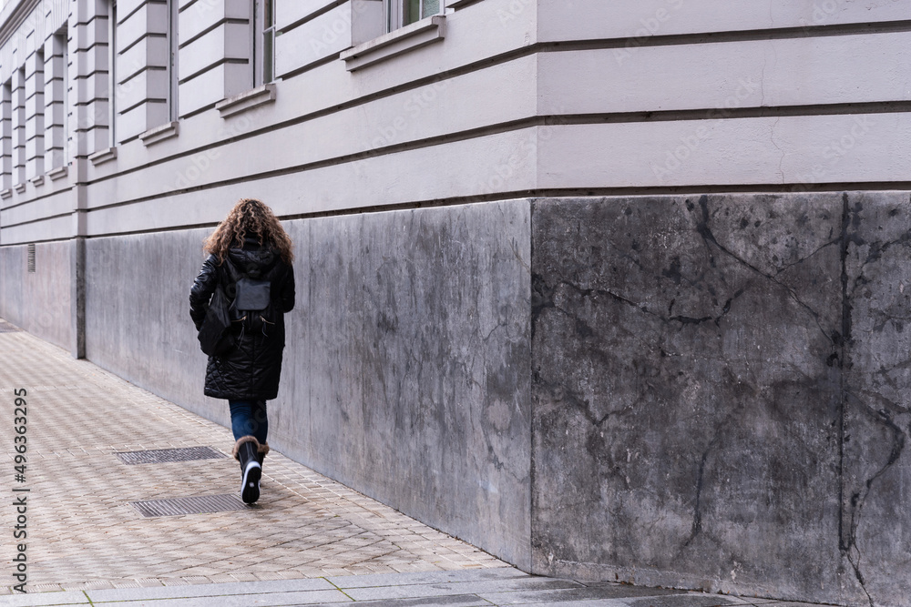 Casual woman walking in a hurry Casual woman walking in a hurry