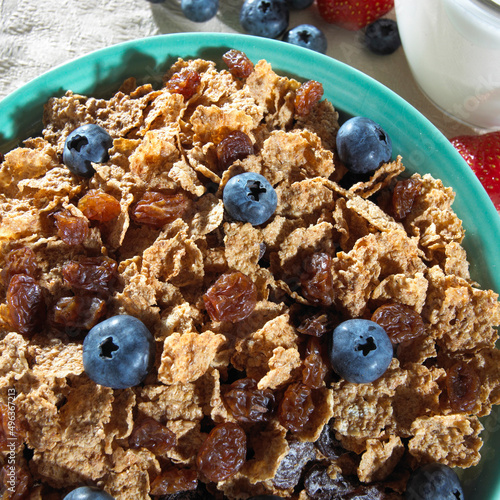 Close-up of corn flakes with blueberries in a bowl photo