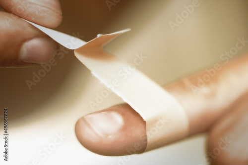 Close-up of a person's finger with a bandage photo