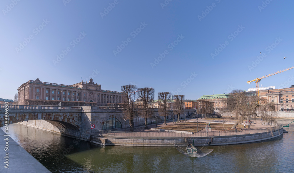 Naklejka premium Troubled water in the rivers at the parterre with round net fishing boats a spring morning in Stockholm
