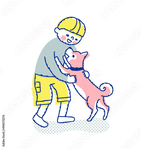犬と戯れ合う男の子